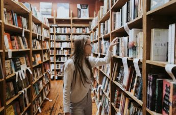 young lady perusing books