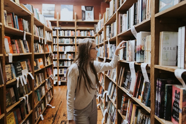 young lady perusing books