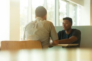 2 men in serious conversation